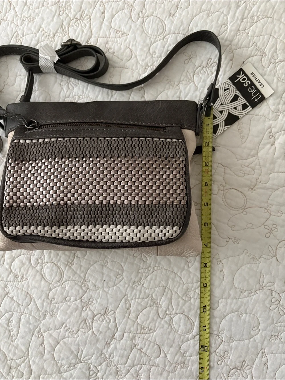 The Sak Leather Messenger Bag in Black and Cream Woven Front